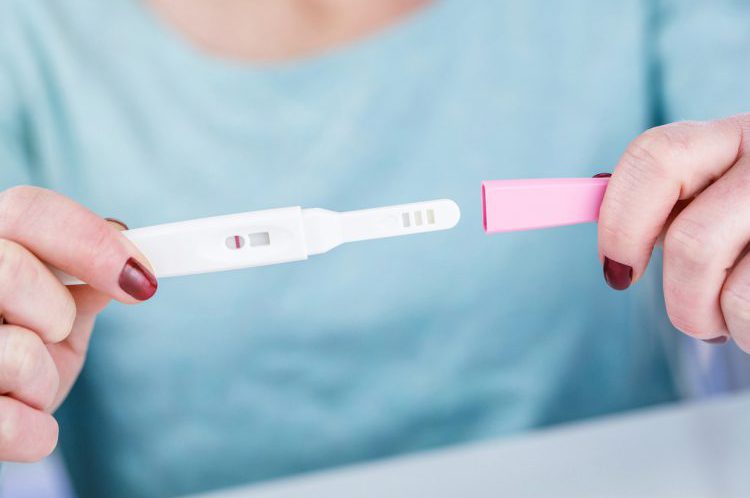 Woman Holding Pregnancy Test