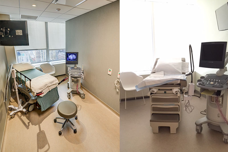 Two medical exam rooms with ultrasound machines, exam tables, and stools. The rooms are well-lit with large windows and neutral-colored walls and floors. Medical monitors and supplies are visible in both rooms.
