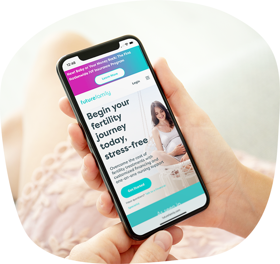 A person holding a smartphone displaying a website about beginning a stress-free fertility journey, featuring a smiling woman, informational text, and a “Get Started” button.
