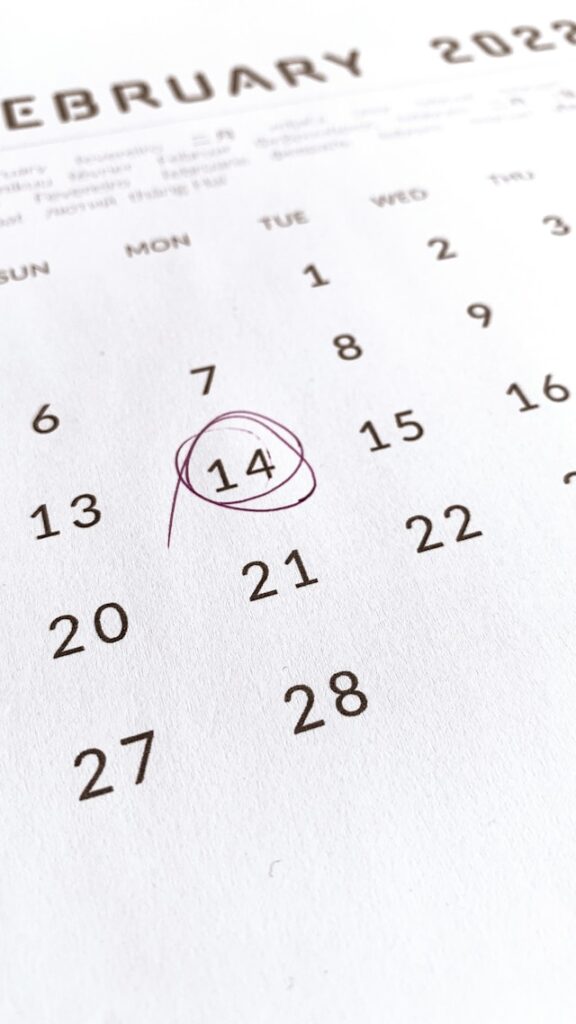 A close-up of a February 2022 calendar page with the 14th circled in purple ink, highlighting Valentine’s Day and marking the 2-week wait after IVF.