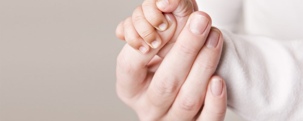 "Two hands. One big, one small."